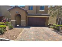 Charming two-story home with a two car garage and manicured landscaping at 181 Elexese Ct, Las Vegas, NV 89183