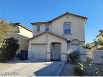 Two-story house with attached garage and landscaped front yard at 4202 Mango Tree Ct, Las Vegas, NV 89115