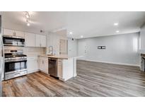 Modern kitchen with stainless steel appliances and white cabinets at 7905 Idledale Ct # 102, Las Vegas, NV 89145