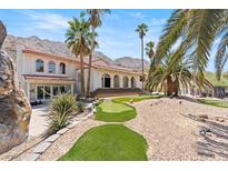 Stunning desert home with putting green, pool, and mountain views at 672 Los Feliz St, Las Vegas, NV 89110