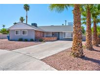 Gray house with a brick facade and a well-maintained front yard at 821 Mar Jay Ct, Las Vegas, NV 89107