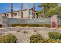 Elegant community signage featuring the name Carlisle, set amidst lush landscaping and stately architecture at 1701 King James St # 101, Las Vegas, NV 89144