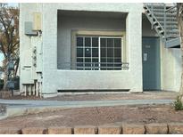 Building exterior featuring a teal door, stairs, and a window at 3318 N Decatur Blvd # 1073, Las Vegas, NV 89130
