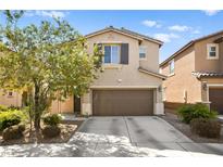 Two-story house with brown garage door and landscaping at 6389 Jacobville Ct, Las Vegas, NV 89122