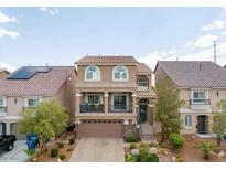 Two-story house with a large garage and balcony at 6861 Philharmonic Ave, Las Vegas, NV 89139