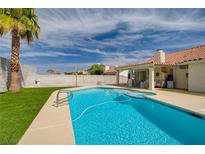 Inviting backyard oasis featuring a sparkling pool and spa at 373 Bradford Dr, Henderson, NV 89074