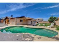 Inviting pool area, perfect for relaxing or entertaining, with ample seating space and a covered patio at 4440 E Boston Ave, Las Vegas, NV 89104