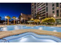 Resort-style pool and spa with palm trees and city views at 222 Karen Ave # 2308, Las Vegas, NV 89109