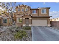 Two story house with attached garage and landscaping at 6513 Heavenly Moon St, North Las Vegas, NV 89084