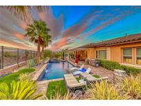 Stunning pool and spa with lounge chairs, creating a relaxing outdoor space at 70 Portezza Dr, Henderson, NV 89011