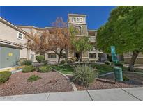 Exterior of a two-story building with landscaping and parking at 8777 W Maule Ave # 1094, Las Vegas, NV 89148