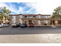 Tan colored building with covered parking and landscaped grounds at 9000 Las Vegas Blvd # 2243, Las Vegas, NV 89123