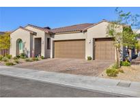 Single-story home with three-car garage and landscaped front yard at 349 Agnew St, Las Vegas, NV 89138