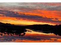 Scenic sunset view over water reflecting the colorful clouds and mountains in the background at 4 Via Centrale # 1, Henderson, NV 89011