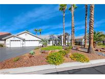 Single-story house with landscaped yard, driveway, and three-car garage at 4620 Clay Peak Dr, Las Vegas, NV 89129