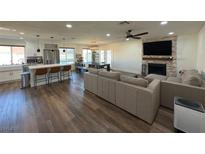 Open living room and kitchen with modern appliances and island at 5640 Judith Resnik Ct, Las Vegas, NV 89103