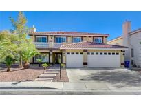 Two-story house with a three-car garage and a landscaped front yard at 7978 Coronado Coast St, Las Vegas, NV 89139