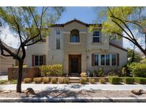 Two-story house with a landscaped yard and attractive curb appeal at 9048 Rich Amethyst Ct, Las Vegas, NV 89149