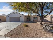 Single-story house with attached garage and landscaped front yard at 10229 Angels Loft St, Las Vegas, NV 89131