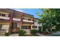 Two-story building with balconies and a well-maintained exterior at 350 E Desert Inn Rd # 202, Las Vegas, NV 89109