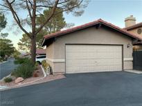 Attached garage with automatic door opener and ample space for parking at 3996 Tirana Way, Las Vegas, NV 89103