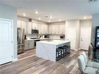Modern kitchen with stainless steel appliances and an island at 498 Granite Arch St, Las Vegas, NV 89138