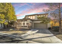 Two-story house with attached garage and landscaping at 9236 Arbor Glen St, Las Vegas, NV 89123