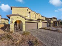 Three-unit townhome complex, two-car garages, paver driveways at 315 Bay Village Pl, Henderson, NV 89011