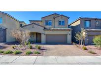 Two-story home with attached garage and landscaped front yard at 859 Benning St, Henderson, NV 89011