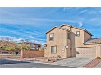 Two-story house with attached garage and landscaped yard at 9936 Fountain Walk Ave, Las Vegas, NV 89149