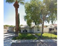 Cozy single-story house with carport and mature landscaping at 509 5Th St, Boulder City, NV 89005
