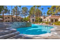Enjoy this community pool featuring cool blue water and desert landscaping in a beautiful setting at 517 Indian Bluff St # 103, Las Vegas, NV 89145