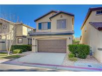 Two-story house with brown garage door and green shutters at 5648 Ancient Agora St, North Las Vegas, NV 89031