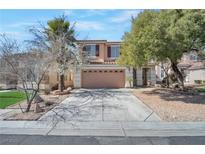 Charming two-story home featuring a well-maintained yard and a two-car garage, located in a suburban neighborhood at 5915 Poplar Tree St, Las Vegas, NV 89148