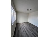 Bright living room with gray vinyl flooring and large windows at 521 S Maryland Pkwy # A10, Las Vegas, NV 89101