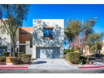 Contemporary two-story home with attached garage and landscaped front yard at 6471 Spiced Butter Rum St, North Las Vegas, NV 89084