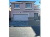 Two-story house with attached garage and neutral color scheme at 9247 Tulip Trestle Ave, Las Vegas, NV 89148