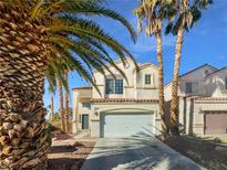 Two-story house with attached garage,palm trees, and a paved driveway at 9511 Withering Pine St, Las Vegas, NV 89123