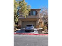 Two-story house with attached garage and landscaping at , North Las Vegas, NV 89081