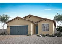 Single-story home with two-car garage and desert landscaping at 2739 Avril Point St, Las Vegas, NV 89156