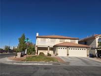 Two-story house with a three-car garage and well-manicured lawn at 502 Pale Pueblo Ct, Las Vegas, NV 89183