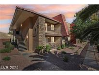 Two-story building with multiple units and a walkway at 5350 River Glen Dr # 307, Las Vegas, NV 89103