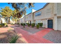 Two-story stucco building with brick walkways and landscaping at 5383 Mountain Vista St # 18, Las Vegas, NV 89120