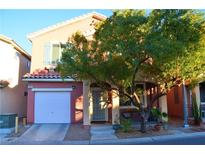 Two-story house with attached garage and landscaped front yard at 5402 Cross Meadows Ln, Las Vegas, NV 89122