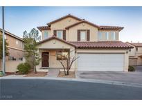 Two-story house with attached garage and desert landscaping at 6005 Bristol Crest Ln, Las Vegas, NV 89139