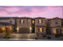 Two-story house with a neutral color scheme and a landscaped front yard at 9622 Aqua Harbor Way, Las Vegas, NV 89178