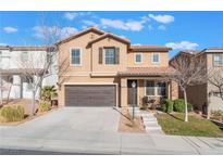 Two-story house with brown accents and a landscaped front yard at 10444 Britton Hill Ave, Las Vegas, NV 89129