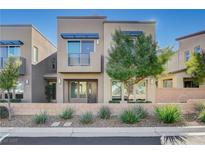 Modern two-story home with landscaped front yard and two-car garage at 11275 Idyllic Dr # 101, Las Vegas, NV 89135