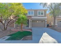 Two-story house with a gray exterior, two-car garage, and landscaped front yard at 6607 Musette Ave, Las Vegas, NV 89139