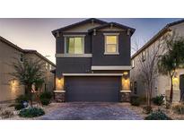 Two story home with gray exterior and attached garage at 9181 Theodore Ct, Las Vegas, NV 89178